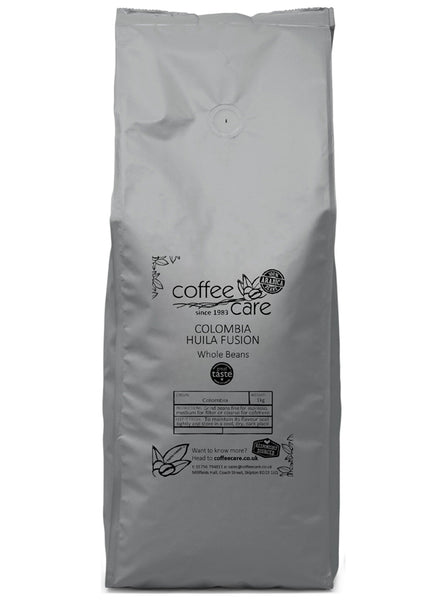 A 1 kilo grey recyclable packet of Coffee Care’s Colombia Huila Fusion Coffee Beans. Freshly roasted Colombian coffee. 100% arabica beans