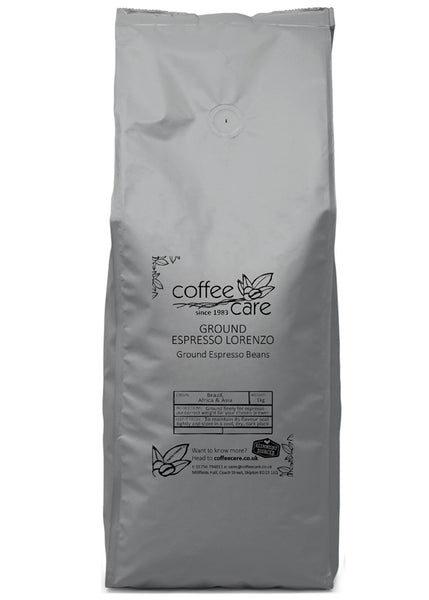 A 1 kilo grey recyclable packet of Coffee Care’s Espresso Lorenzo Ground Espresso Beans. Freshly roasted & ground Brazil, Africa & Asia Coffee.
