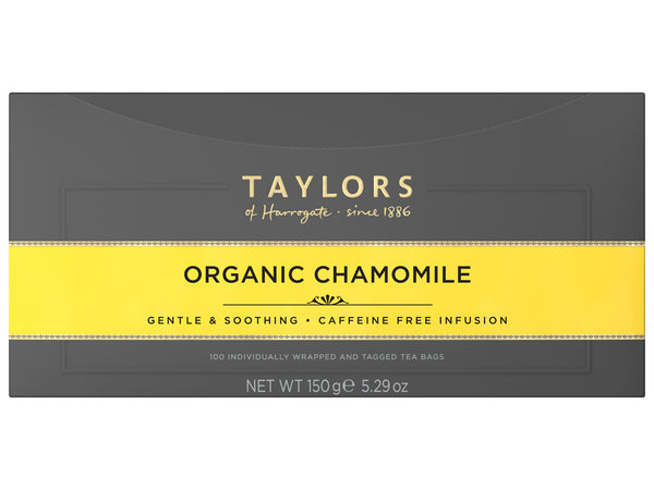 A large grey cardboard box with 100 individually wrapped and tagged Taylors of Harrogate Organic Chamomile. Yellow label – Gentle a& soothing caffeine free infusion