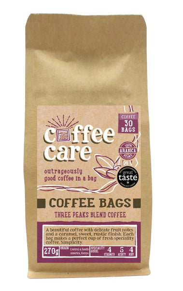 A kraft packet of Coffee Care’s Three Peaks Blend Coffee Bags. 30 coffee bags of speciality freshly roasted & ground , Central & South America Coffee. 100% Arabica. Deliciouslyorkshire Winner 2017 and Great Taste Award 1 Star 2021
