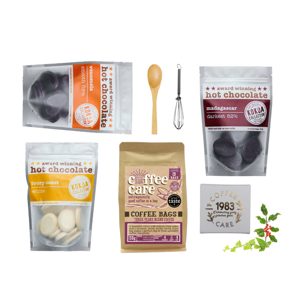 Hamper products laid out of the chocoholic and coffee lover. Coffee Bags, Kokoa Collection white, Venezuela, Madagascar, whitakers chocolate truffles, bamboo spoon and whisk