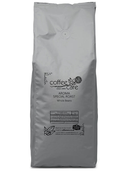 A 1 kilo grey recyclable packet of Coffee Care’s Aroma Special Roast Coffee. Papua New Guinea & Ethiopia whole coffee beans. 100% Arabica whole beans