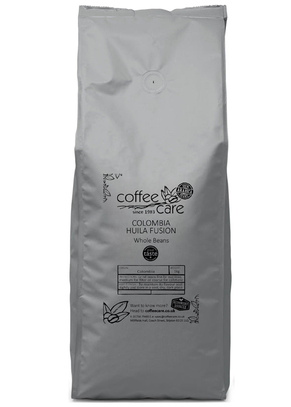 A 1 kilo grey recyclable packet of Coffee Care’s Colombia Huila Fusion Coffee Beans. Freshly roasted Colombian coffee. 100% arabica beans