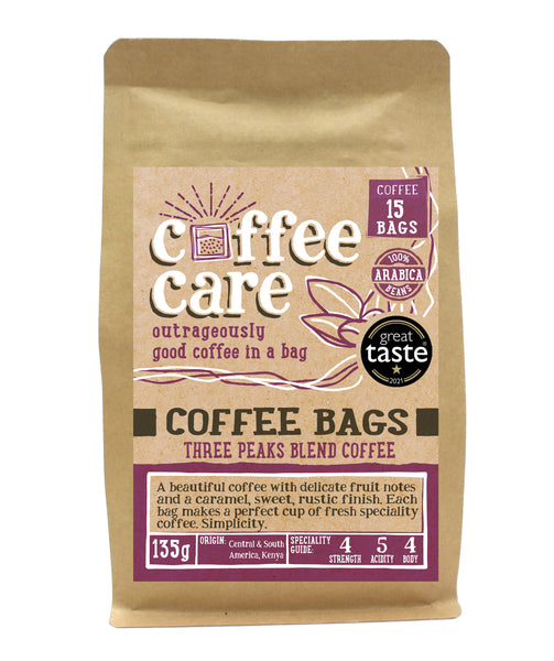 A kraft packet of Coffee Care’s Three Peaks Blend Coffee Bags. 15 coffee bags of speciality freshly roasted & ground , Central & South America Coffee. 100% Arabica. Deliciouslyorkshire Winner 2017 and Great Taste Award 1 Star 2021