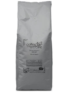 A 1 kilo grey recyclable packet of Coffee Care’s Deliciously Decaf coffee Beans. Freshly roasted Brazil and India coffee. 