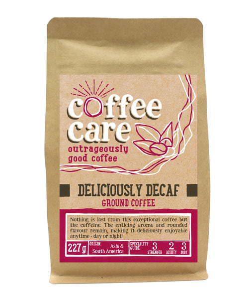A 227g kraft packet of Coffee Care’s Deliciously Decaf ground coffee. Pink label ground for filter & cafetiere. Freshly ground South America and Asia coffee beans