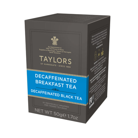 Side view of small grey cardboard box with 20 individually wrapped and tagged Taylors of Harrogate Decaffeinated Breakfast Tea. Blue label –Bright & refreshing black tea
