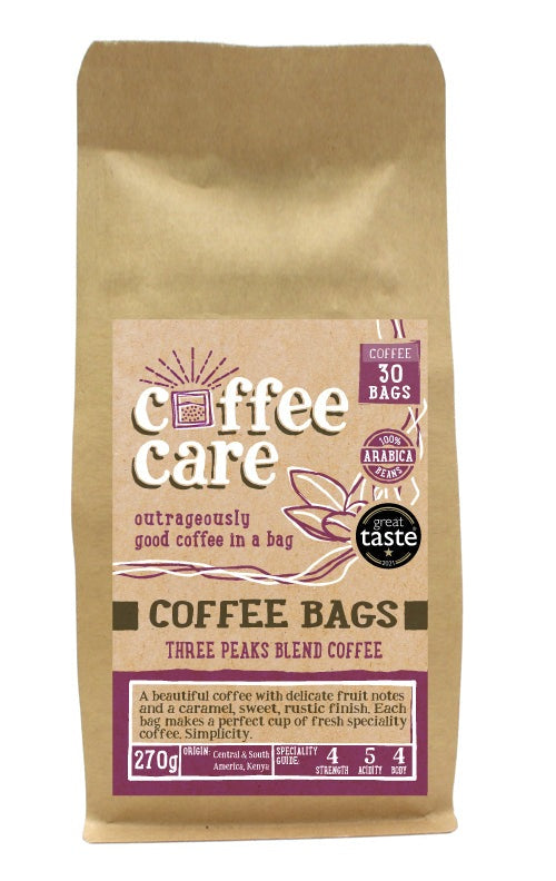 A kraft packet of Coffee Care’s Three Peaks Blend Coffee Bags. 30 coffee bags of speciality freshly roasted & ground , Central & South America Coffee. 100% Arabica. Deliciouslyorkshire Winner 2017 and Great Taste Award 1 Star 2021 