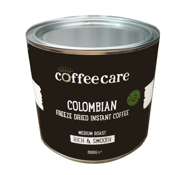 Higher view showing the lid to a metal tin of Coffee Care's Colombian Freeze Dried Instant Coffee. 500g of arabica coffee. Medium roast, rich and smooth 