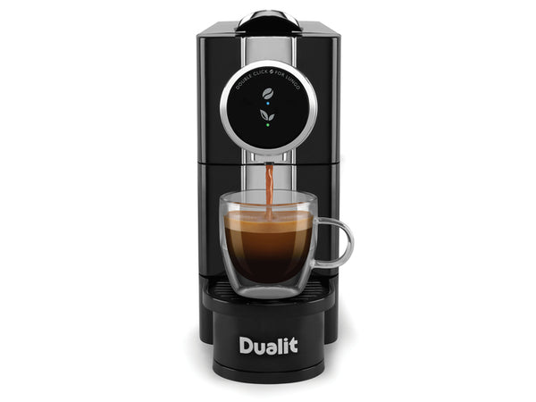 Front view of a Black and Chrome Dualit Cafe Plus Capsule Machine with cup on drip tray