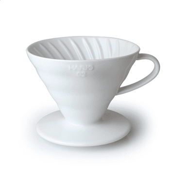 A Hario V60 02 Coffee Dripper. Single white funnel to brew coffee straight into a cup with handle to right hand side