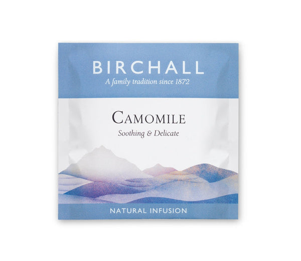 A single blue enveloped tea bag of Birchall Camomile Tea. Soothing & Delicate. Natural Infusion