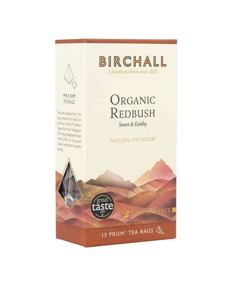 Side view of cardboard box of 15 Birchall Organic Redbush prism tea bags. Orange hill graphics with orange band, sweet & earthy, natural infusion. Caffeine free. Great Taste winner 2014