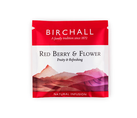 A single red enveloped tea bag of Birchall Red Berry & Flower. Fruity & refreshing. Natural Infusion